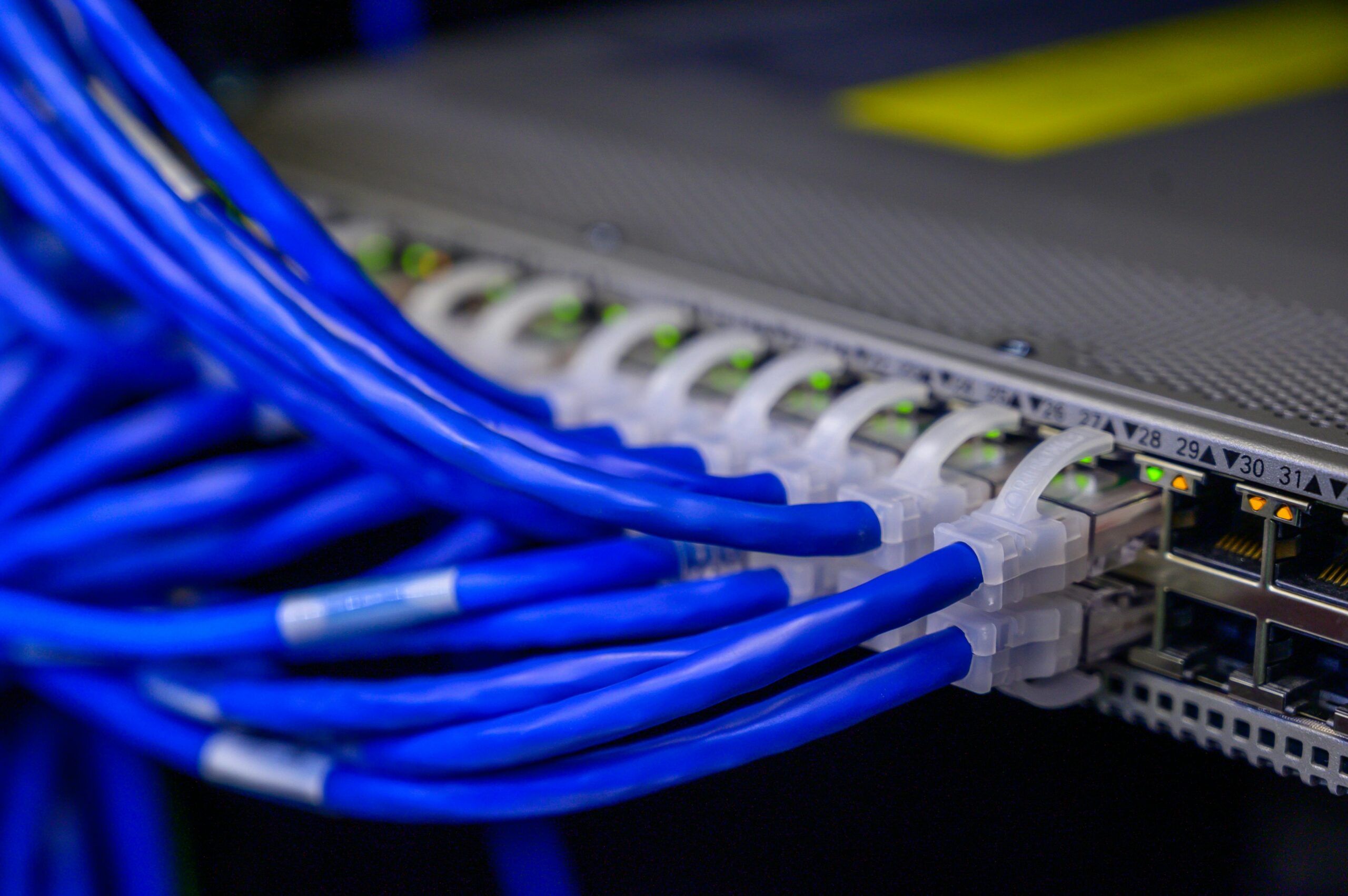 Cables connected to Ethernet ports (https://www.pexels.com/photo/cables-connected-to-ethernet-ports-2881232/)
